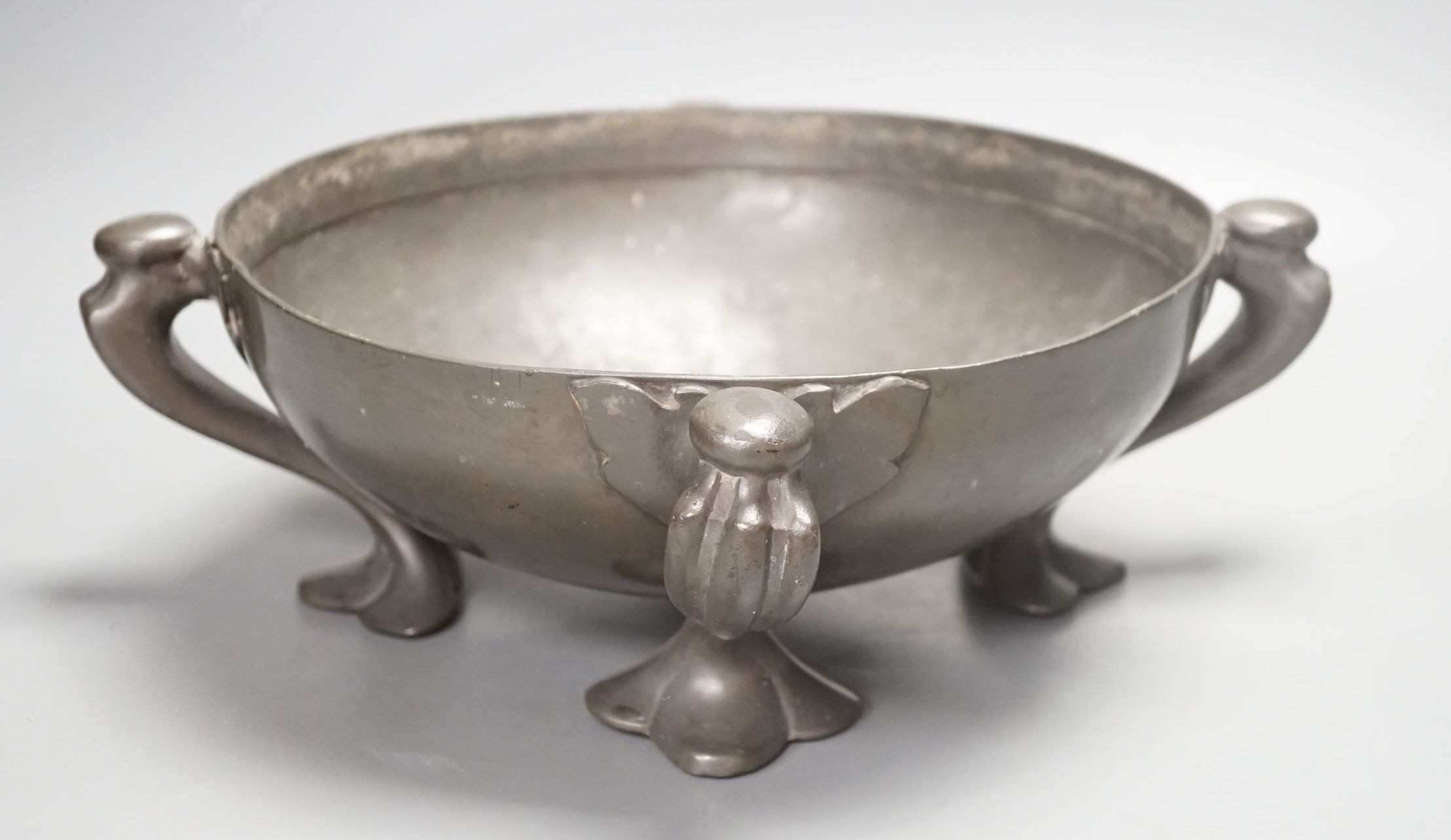 A Tudric four-footed pewter bowl designed by Oliver baker, 33cm, stamped Tudric 067